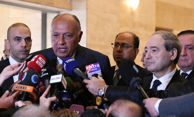 Egyptian Foreign Minister Sameh Shoukry, left, speaks with journalists after his meeting with Syrian Foreign Minister Faisal Mekdad, right, in Damascus, Syria, Monday, Feb. 27, 2023. (AP Photo)