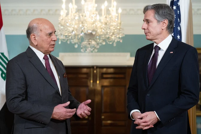 US Secretary of State Antony Blinken and Iraqi Foreign Minister Fuad Hussein speak to the media prior to a meeting, in the Treaty Room of the US State Department in Washington. (AFP)