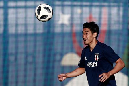 This file photo taken on June 29, 2018 shows Japan's midfielder Shinji Kagawa juggling the football during a training session in Kazan during the Russia 2018 World Cup football tournament. (AFP)