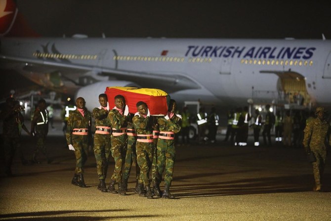 The coffin containing the remains of former Ghana international football player Christian Atsu arrive at the Kotoka International Airport in Accra, Ghana, on February 19, 2023. (AFP)