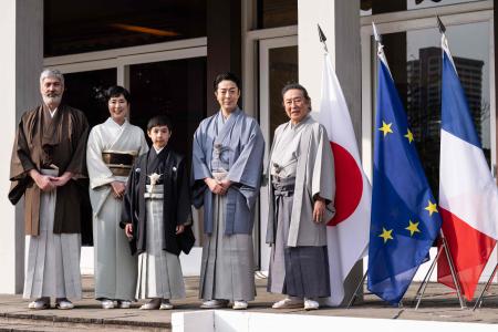 Ten-year-old kabuki actor Maholo Terajima (c) poses for photographs with his father Laurent Ghnassia (left), his mother and actress Shinobu Terajima (2nd L), his uncle and kabuki actor Kikugoro Ogami (2nd R), and his grandfather and kabuki actor Kikunosuke Ogami at the French embassy in Tokyo on February 7, 2023. (AFP)