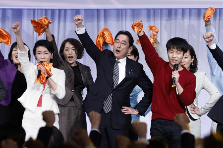 Fumio Kishida (centre) raises his fist with other party members during the party's annual convention in Tokyo, Japan, on Sunday, Feb. 26, 2023. (AP)