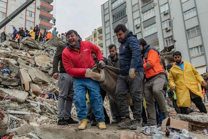 In this video grab from AFP TV taken on Feb. 6, 2023, rescuers search for victims of a 7.8-magnitude earthquake that hit Diyarbakir, in southeastern Turkey. (AFPTV / AFP)
