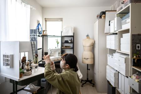 This photo taken on January 31, 2023 shows Minami Murayama, a 34-year-old homemaker who once had ambitions of becoming a fashion designer, arranging her Licca-chan dolls at home in Yokohama. (AFP)