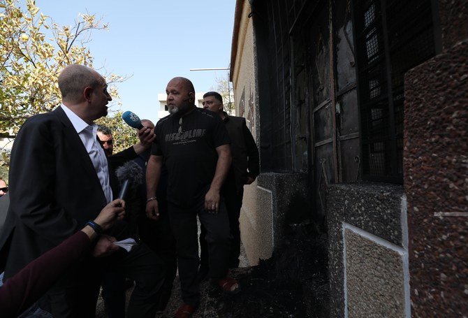 US Special Representative Hady Amr inspecting a burnt house in Hawara. (WAFA)