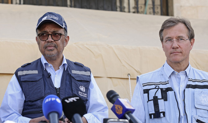 WHO chief Tedros Adhanom Ghebreyesus (L) holds a press conference alongside UN deputy regional humanitarian coordinator David Carden in Bab Al-Hawa on March 1, 2023. (AFP)