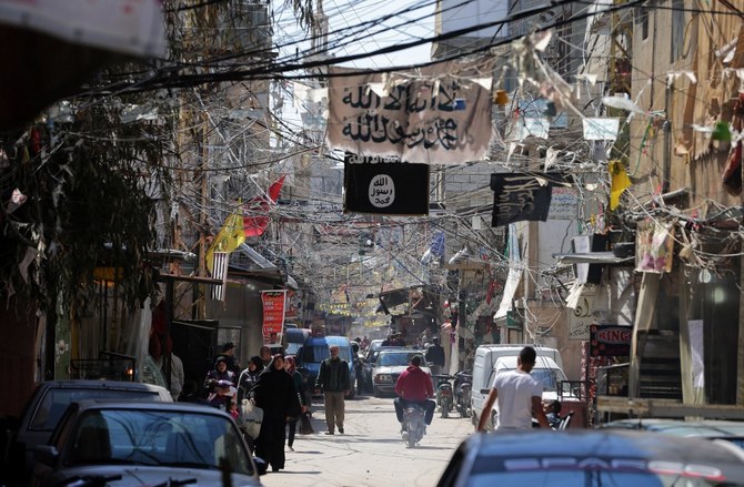 Situation remained tense and armed men deployed to the streets of the camp (AFP)