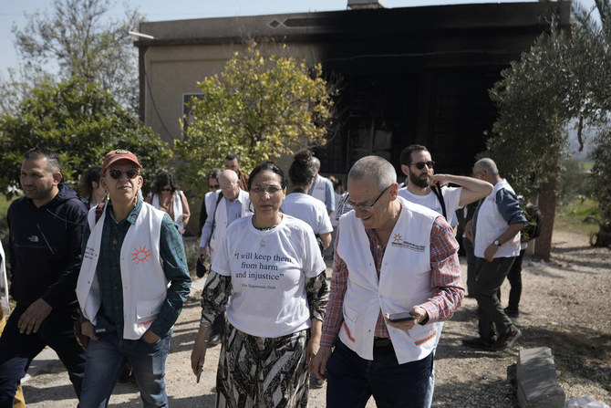 A delegation from Physicians for Human Rights-Israel survey the aftermath of a rampage by settlers in Hawara, near the West Bank city of Nablus, on Mar. 1, 2023. (AP)