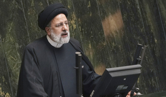 Iranian President Ebrahim Raisi addresses lawmakers while defending his next year's budget bill at the parliament in Tehran, Iran, Sunday, Jan. 22, 2023. (AP)