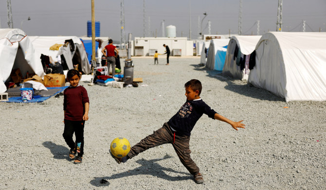 Mohammad Hajj Bakr, 9, whose family is originally from Syria, plays with a ball at a camp populated mostly by Syrians in the aftermath of the deadly earthquake in Antakya, Turkey, March 2, 2023. (REUTERS)