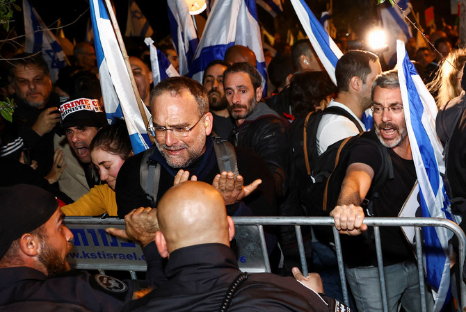 People push a barrier in front of police during a demonstration, as Netanyahu’s nationalist coalition government presses on with its contentious judicial overhaul, in Jerusalem. (File/Reuters)