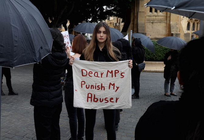 US-Lebanese model Nour Arida (C) join activists and survivors in front of the Lebanese parliament, in Beirut. (File/AFP)