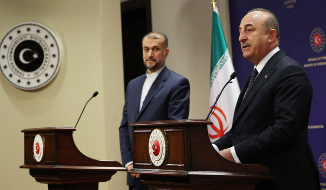 Turkish Foreign Minister Mevlut Cavusoglu (R) and Iranian Foreign Minister Hossein Amir-Abdollahian (L) give a press conference following their meeting in Ankara,on March 8, 2023. (AFP)