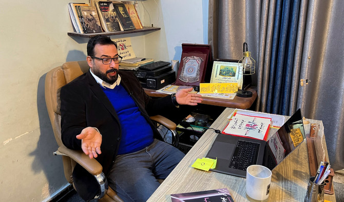 Iraqi journalist Muntazer Al-Zaidi, who gained fame for hurling his shoes at President George W. Bush, sits at his home in Baghdad. (Reuters)