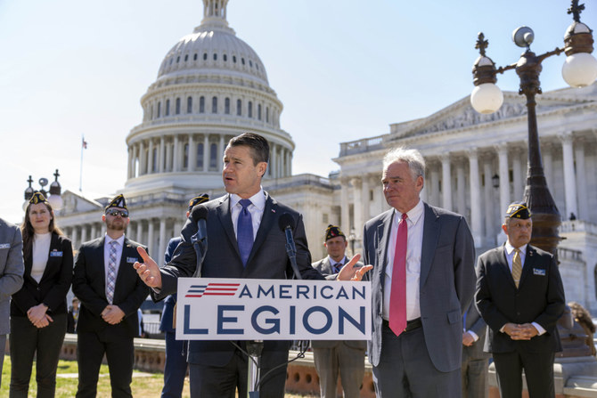 US Senators Todd Young and Democrat Sen. Tim Kaine (right) are joined by representatives of the American Legion as they speak to reporters in Washington on March 16, 2023, about ending the authorization for use of military force enacted after the Sept. 11, 2001 terrorist attacks. (AP)
