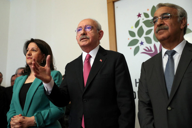 Kemal Kilicdaroglu, the Turkish opposition alliance’s joint candidate, center, briefs the media after meeting with Pervin Buldan and Mithat Sancar, co-leaders of the pro-Kurdish Peoples’ Democratic Party on March 20, 2023. (Republican People’s Party via Reuters)