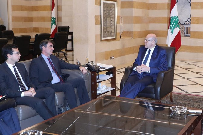 A handout picture provided by the Lebanese photo agency Dalati and Nohra on March 23, 2023 shows Lebanese caretaker prime minister Najib Mikati meeting with a delegation from the Ineternational Monetary Fund (IMF) at the governmental palace in Beirut on March 23, 2023. (AFP)