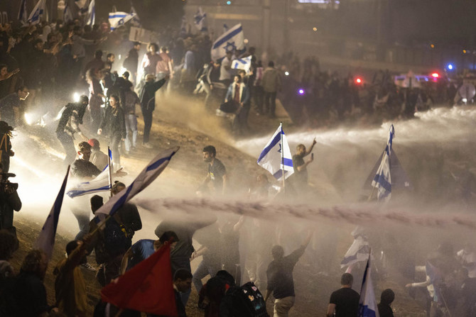 Thousands of Israelis have poured into the streets across the country in a spontaneous outburst of anger after prime minister Benjamin Netanyahu abruptly fired his defense minister for challenging the Israeli leader’s judicial overhaul plan. (AP)