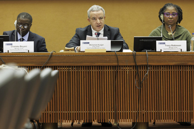 Mohamed Auajjar, center, Chairperson of the Independent Fact-Finding Mission on Libya, Chaloka Beyani, left, and Tracy Robinson, members of the Fact-Finding Mission, speak to the media ahead of presenting the findings of the final report. (AP)