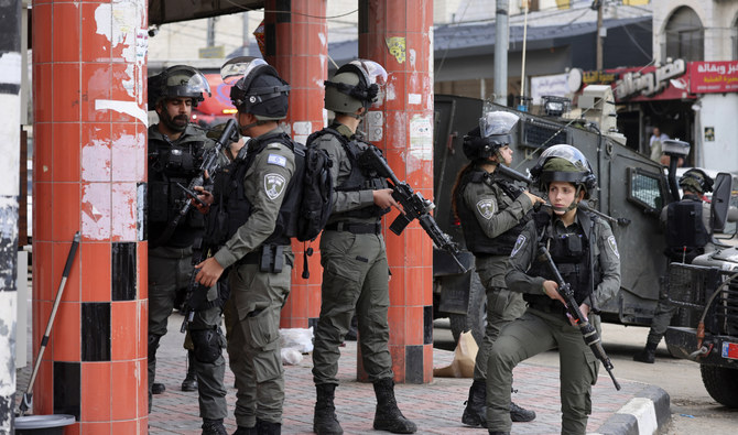 Israeli troops patrol in the occupied West Bank town of Huwara, on March 26, 2023. (AFP)