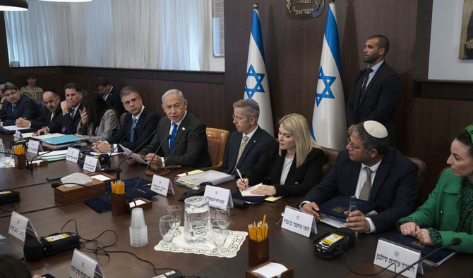 Israel’s Prime Minister Benjamin Netanyahu chairs the weekly cabinet meeting on March 12, 2023. (AFP)