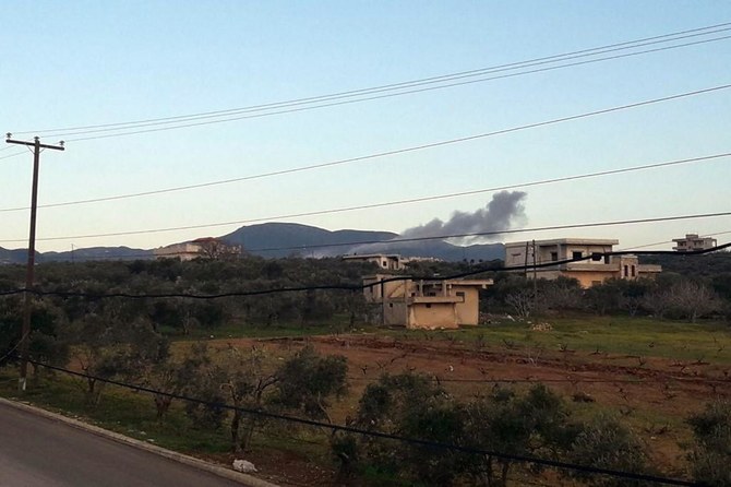 A file photo released on March 12, 2023 by the official Syrian Arab News Agency shows smoke billowing from a site targeted by Israeli airstrikes in Masyaf in the central Hama countryside. (AFP)