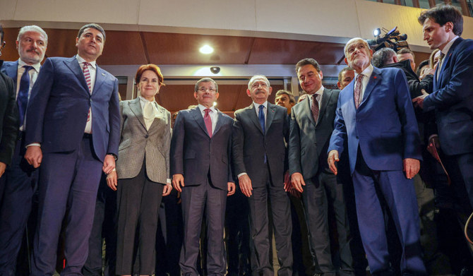 Six opposition parties (L/R): (DP) Democrat Party Chairman Gultekin Uysal, IYI Party Chairman Meral Awakeners, Future Party Chairman Ahmet Davutoglu, CHP Chairman Kemal Kilicdaroglu, DEVA Party Chairman Ali Babacan and Saadet Party (SP) Chairman Temel Karamollaoglu posing after meeting to confirm Kemal Kilicdaroglu (CHP) as the Turkish opposition's joint candidate to run against President Recep Tayyip Erdogan in Turkey's Presidential elections in May, in Ankara, on March 6, 2023. (AFP)