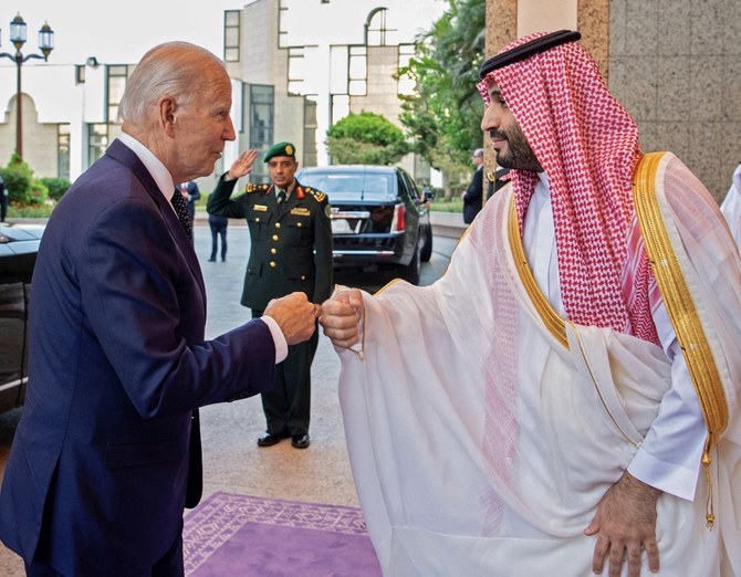 Saudi Crown Prince Mohammed bin Salman greets Joe Biden with a fist bump after the US president’s arrival in Jeddah. (SPA)