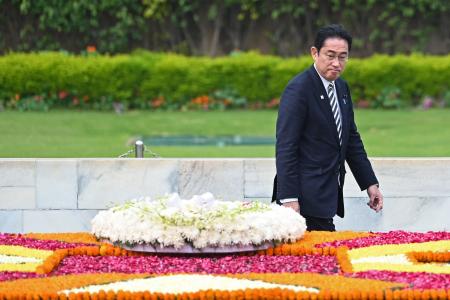 Japan's Prime Minister Fumio Kishida walks after placing a wreath at the Mahatma Gandhi memorial at Rajghat in New Delhi on March 20, 2023. Kishida arrived in India on March 20 for talks expected to focus on deepening trade and technology ties as well as shared concern about China. (AFP)