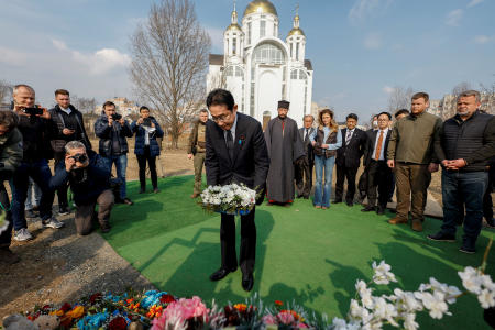 Japanese Prime Minister KISHIDA Fumio visits a site of a mass grave, in the town of Bucha, amid Russia's attack on Ukraine, outside of Kyiv, Ukraine on March 21. (AFP)