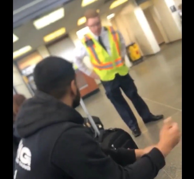 A video screengrab shows a Via Rail security guard approaching a Muslim man and asking him not to pray inside an Ottawa train station. The guard has been suspended and is currently being investigated. (Twitter/@nccm)