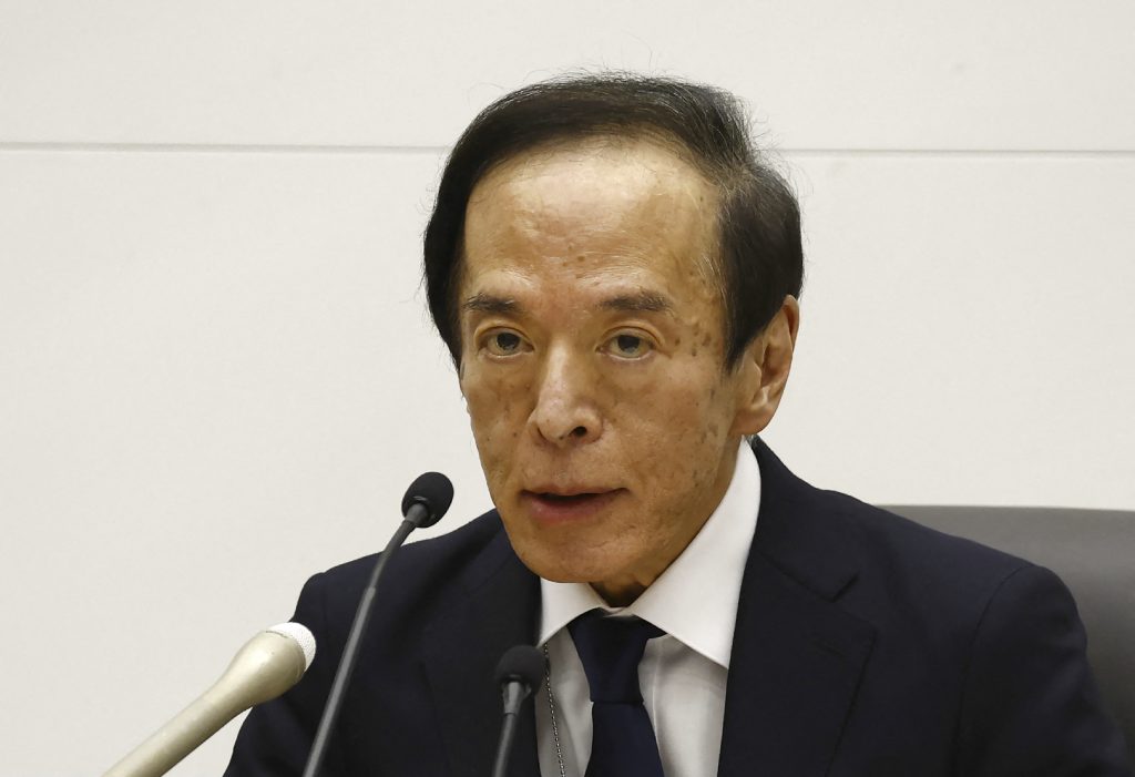 The Bank of Japan will continue monetary easing to achieve its 2% inflation target accompanied by wage hikes. (AFP)