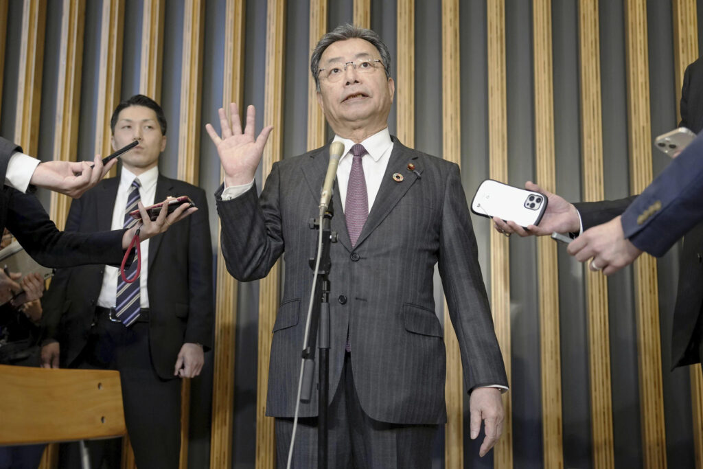 Chairperson of the National Public Safety Commission Koichi Tani speaks to reporters in Tokyo Wednesday, April 26, 2023. (Kyodo News via AP)