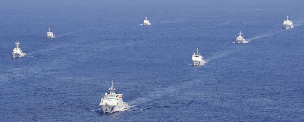 Four China coast guard vessels, right, are followed by Japan coast guard ships as they intruded into Japan's territorial waters near the disputed East China Sea islands called Senkaku by Japan and Diaoyu by China on Sept. 10, 2013. (File/Kyodo News via AP)