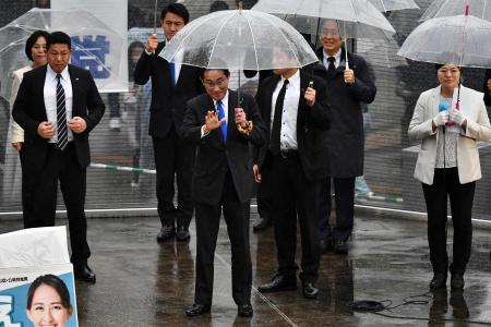 Japan's Prime Minister Fumio Kishida (centre) attends an election campaign in support of the Liberal Democratic Party candidate in Urayasu, Chiba prefecture, on April 15, 2023. (AFP)