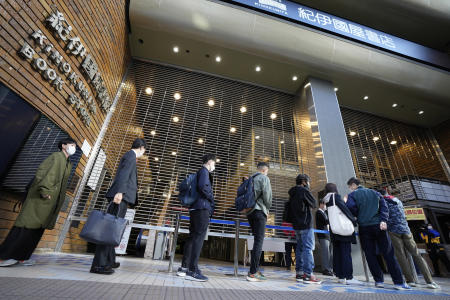 Customers queue up to buy Japanese writer Haruki Murakami's new novel 