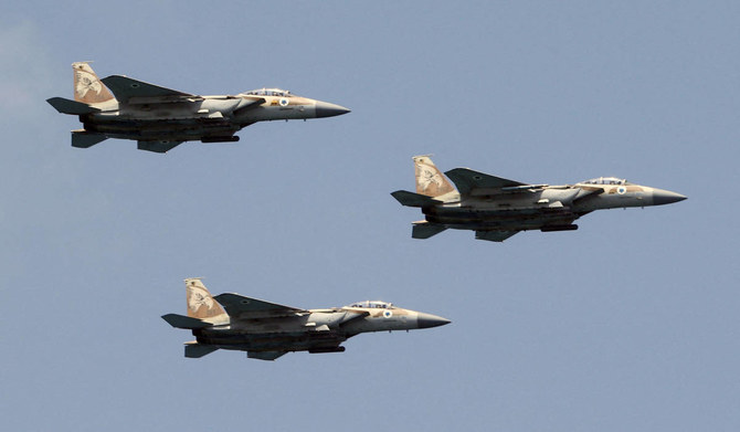 Israeli F-15 fighter jets perform during an air show over the beach in the Israeli coastal city of Tel Aviv on May 5, 2022, as Israel marks Independence Day (Yom HaAtzmaut), 74 years since the establishment of the Jewish state. (AFP)