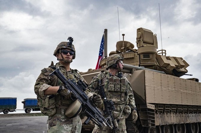 Above, American troops deployed on the outskirts of Rumaylan in Syria’s northeastern Hasakeh province, bordering Turkey, on March 27, 2023. (AFP file photo)