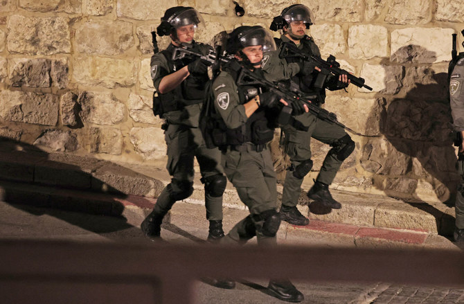 Israeli border guards patrol outside the Al-Aqsa Mosque compound at Lion's Gate in Jerusalem's Old City during clashes with Palestinians in Al-Aqsa Mosque on April 5, 2023. (AFP)