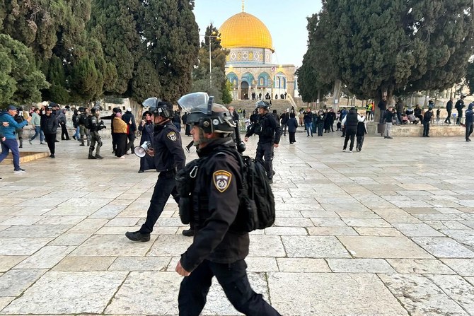 Israeli police walk inside the Al-Aqsa Mosque compound in Jerusalem early on Apr. 5, 2023 after clashes erupted during Ramadan. (AFP)