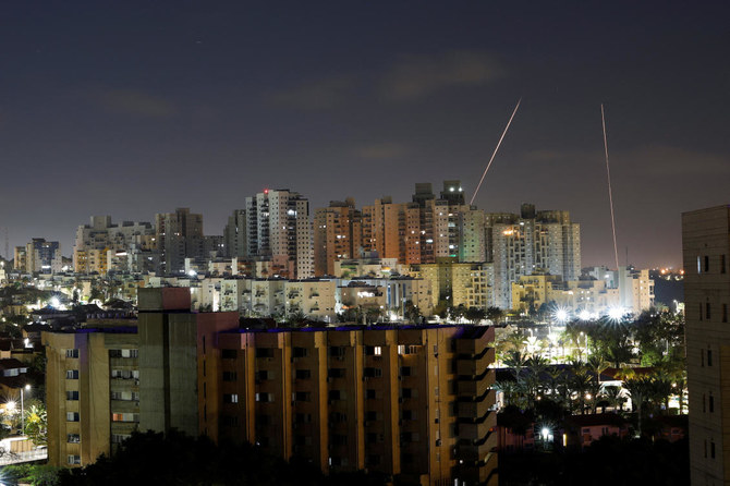 Streaks of lights are seen from Ashkelon, Israel as rockets are launched from the Gaza Strip on April 6, 2023. (Reuters)