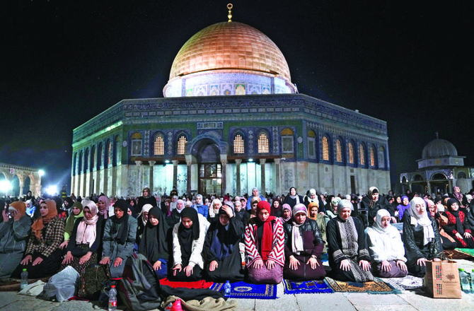 During the holy month, Palestinian worshippers perform Taraweeh, the long evening prayer, at the Al-Aqsa Mosque compound in the Old City of Jerusalem. (AP)