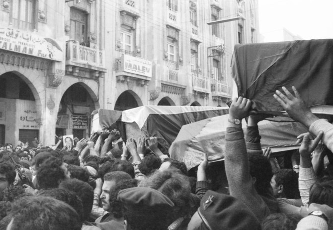 Flag-draped coffins of slain Palestinians killed in Israeli raid are taken through the streets of Beirut, Lebanon on April 12, 1973, during the funeral procession. (AP)