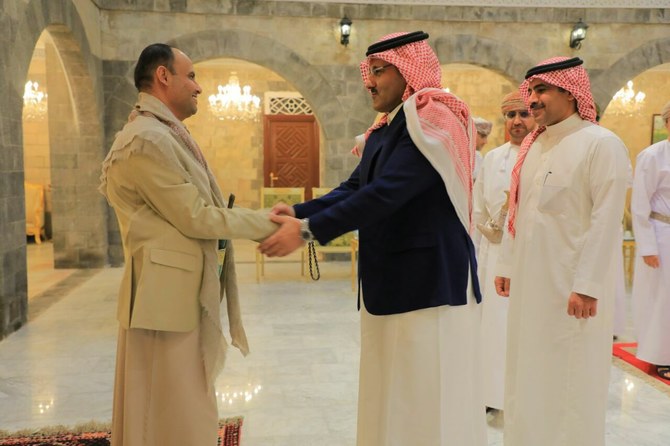 Saudi Arabia’s ambassador to Yemen Mohammed Al-Jaber shakes hands with the political leader of the Houthis, Mahdi Al-Mashat. (@mohdsalj)