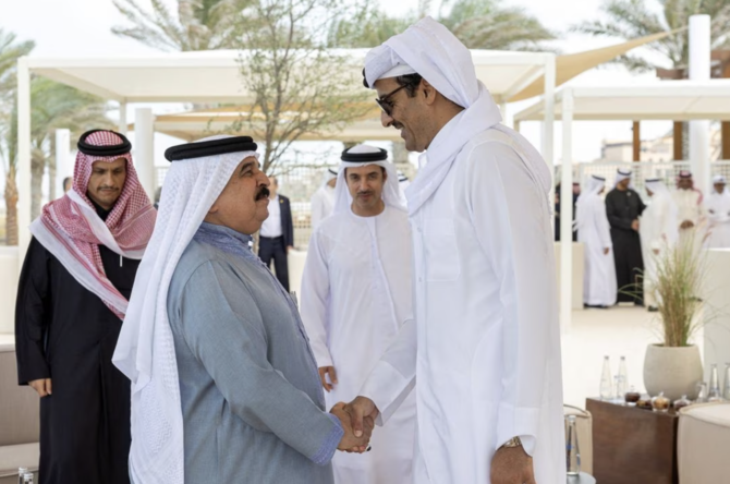 King of Bahrain Hamad bin Isa Al-Khalifa greets Emir of Qatar Sheikh Tamim bin Hamad Al-Thani at St Regis Saadiyat, Abu Dhabi, UAE. (File/Reuters)