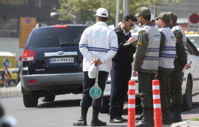 Iran's police forces stand on a street amid the implementation of the new hijab surveillance in Tehran, Iran, April 15, 2023. (REUTERS)