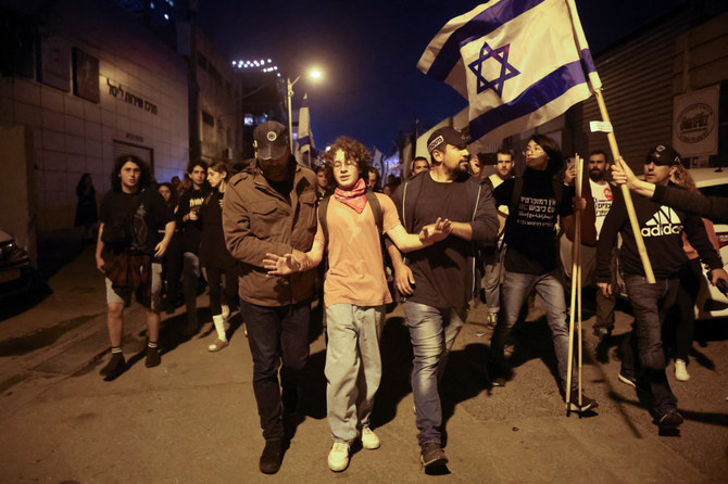 A protester is detained during a demonstration against Israeli Prime Minister Benjamin Netanyahu and his nationalist coalition government's judicial overhaul, in Tel Aviv, on April 15, 2023. (Reuters)