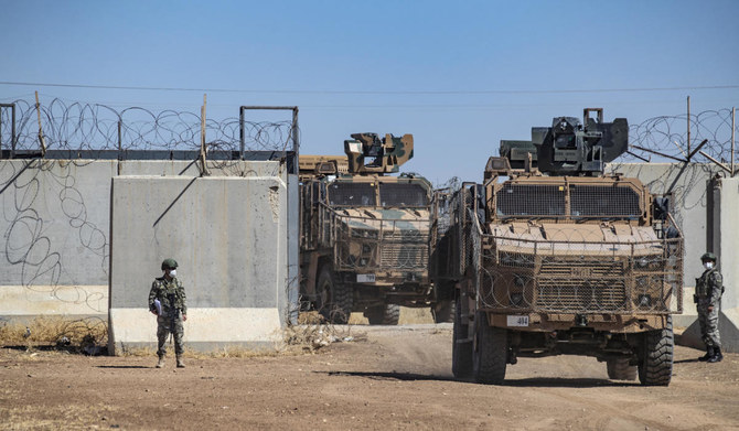 Turkish military vehicles enter Syria to take part in a joint patrol with Russian troops, in the countryside of the town of Derbassiye in Syria's northeastern Hasakeh province, on the border with Turkey, on July 14, 2021. (AFP)