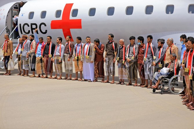 Yemeni government forces who were included in the three-day prisoner exchange disembark from an aircraft upon arrival at Marib airport on April 16, 2023. (AFP)