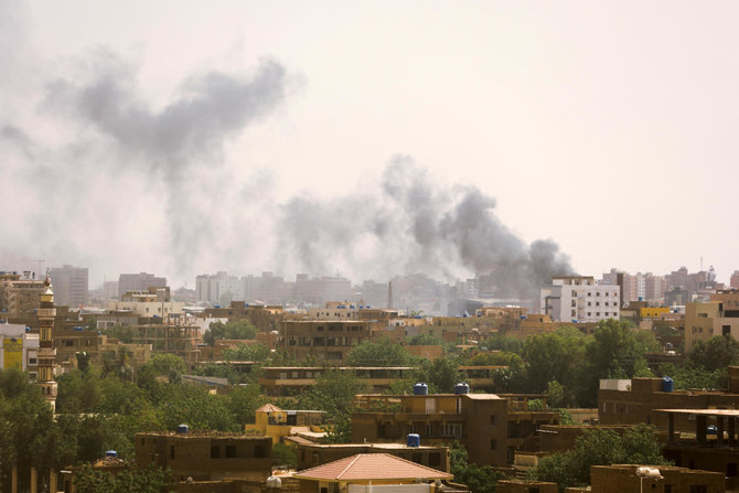 Smoke rises over buildings during clashes between the paramilitary Rapid Support Forces and the army in Khartoum (Reuters)